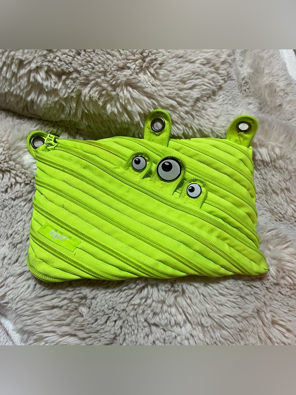 Bright Neon Green Monster Pencil Case with Playful Eye Accents
02-13